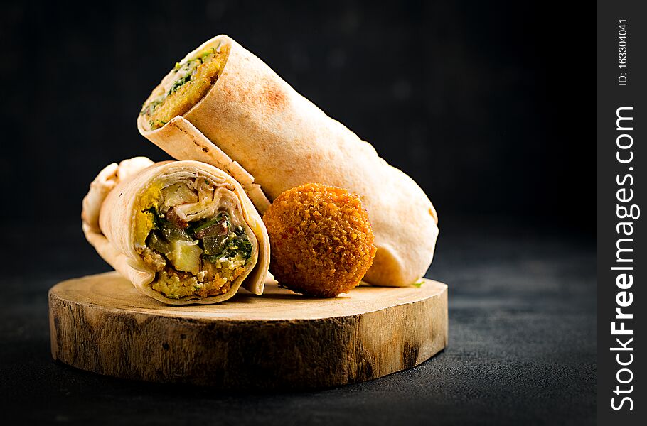 Falafel, Sandwich Falafel on a black background. - Image
Falafel, Sandwich Falafel on a black background. - Image