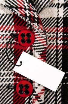 Blank Price Tag On Checked Coat With Red Buttons Stock Photography Blank Price Tag On Checked Coat With Red Buttons Stock Photography