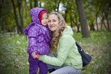 Mother And Daughter In Autumn Park Royalty Free Stock Image