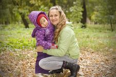 Mother And Daughter In Autumn Park Stock Image
