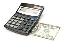 Calculator And 100 Dollars Royalty Free Stock Image