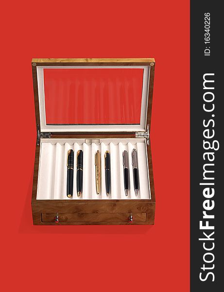 Wooden Box For Pens On Red