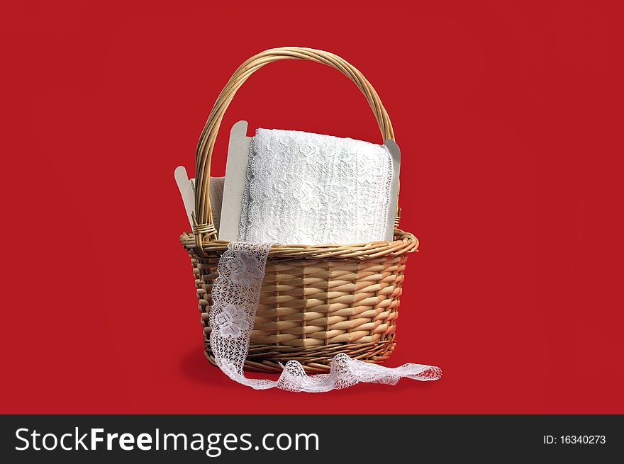 Basket with lace on red background