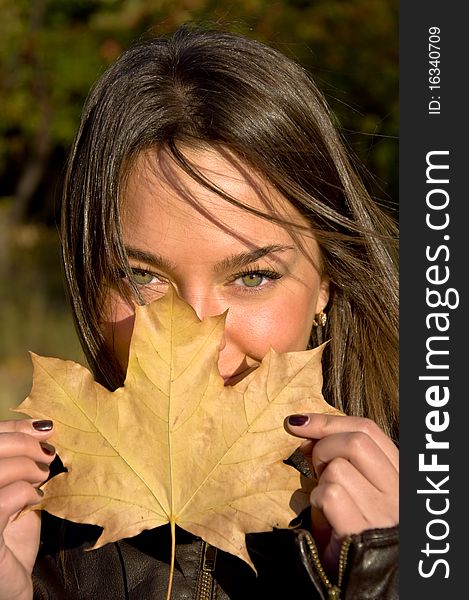 woman holding a maple leaf