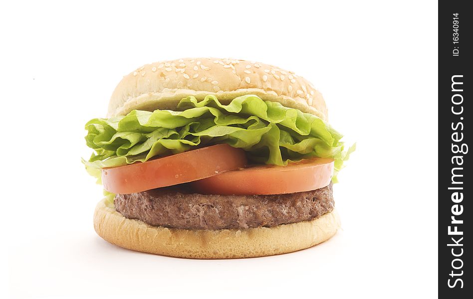 Big Hamburger with sesame bun lettuce, tomato and beef patty. Big Hamburger with sesame bun lettuce, tomato and beef patty