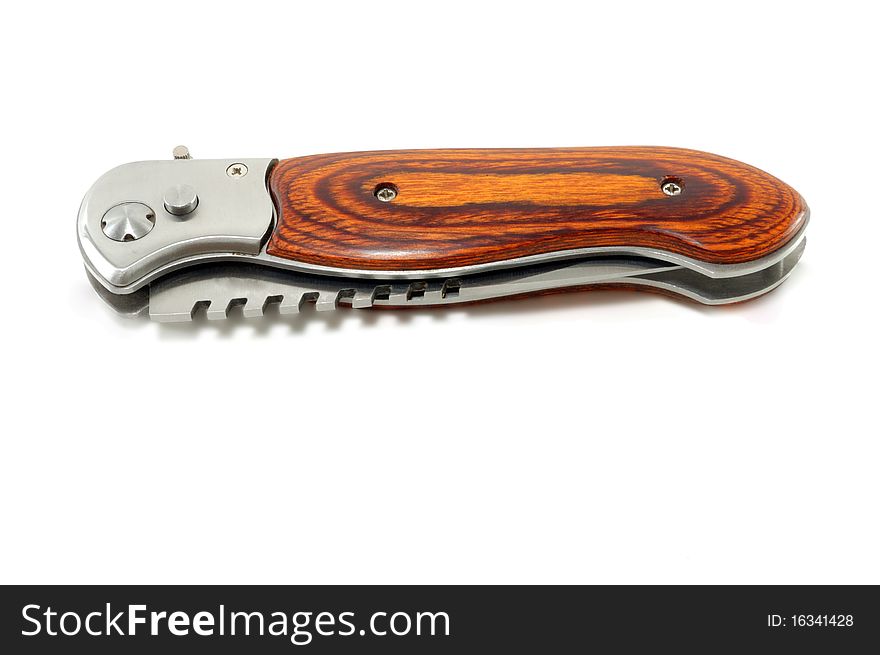 The collapsible closed knife is isolated on a white background. The collapsible closed knife is isolated on a white background