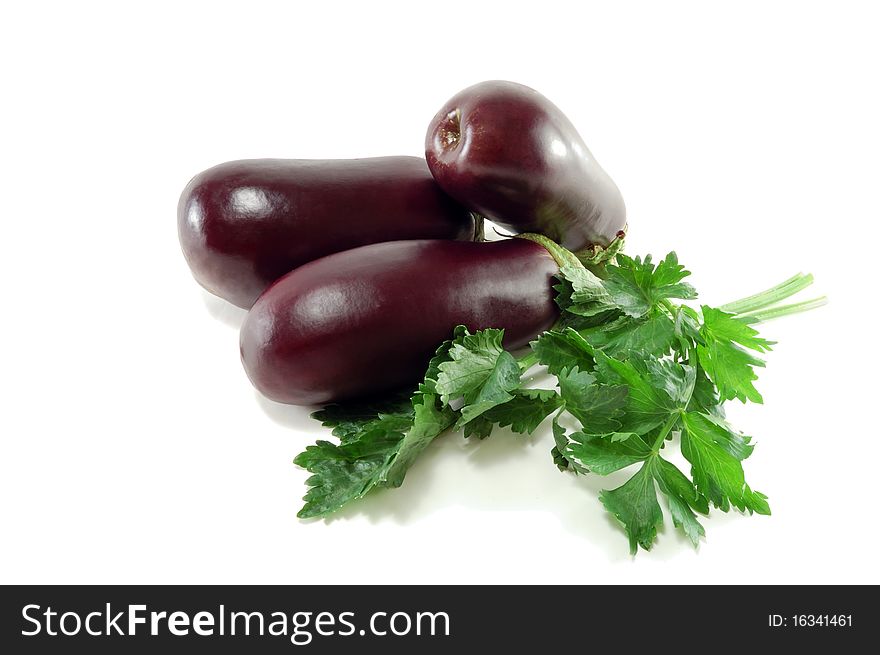 Ripe eggplants and celery greens are isolated on a white background