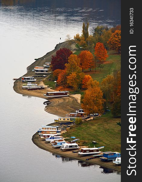 Several houseboats on the coast in autumn. Several houseboats on the coast in autumn.