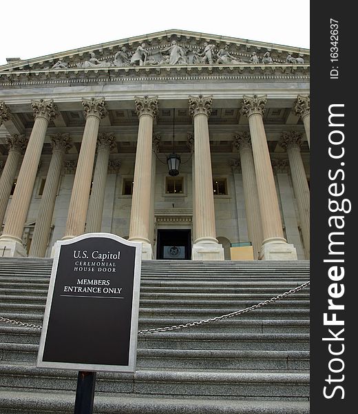 A sign in front of the house of representatives of the capitol in washington dc. A sign in front of the house of representatives of the capitol in washington dc