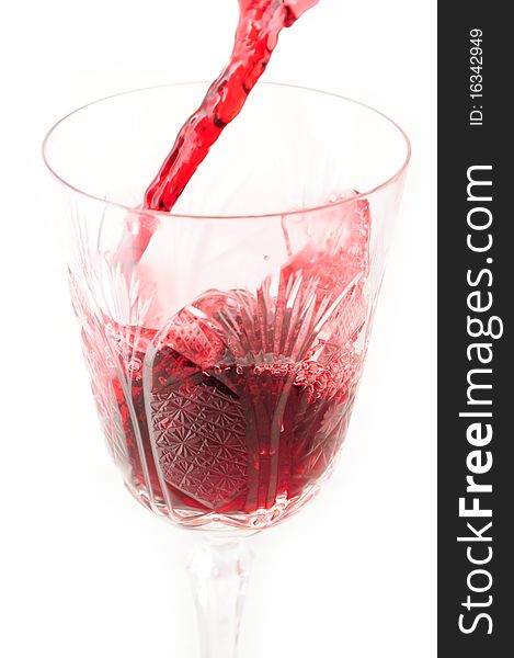 Pouring red wine in a cup. Pouring red wine in a cup