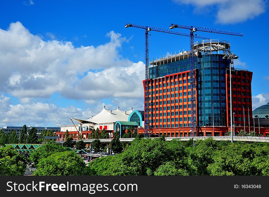 The modern architecture of glass against a backdrop of blue sky