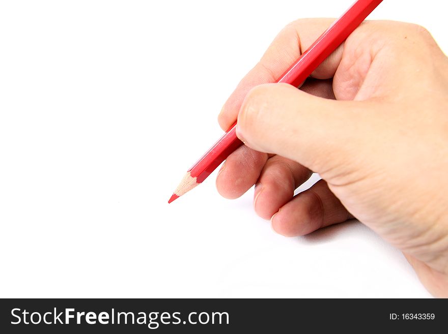 Hand holding a red pencil on white  background