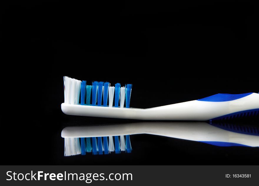 Tooth brush on black background