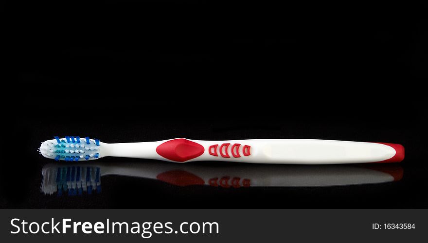 Tooth brush on black background ready to use as is or cut out for your next project.