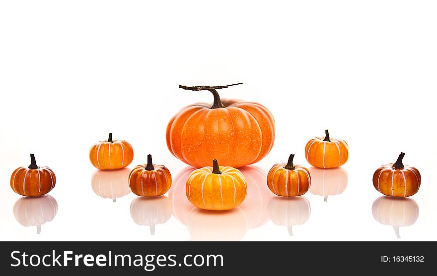 Large And Small Pumpkins In Rows Background.