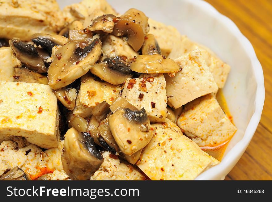 Oriental style spicy mushroom and bean curd delicacy. Suitable for food and beverage, healthy lifestyle, and diet and nutrition. Oriental style spicy mushroom and bean curd delicacy. Suitable for food and beverage, healthy lifestyle, and diet and nutrition.