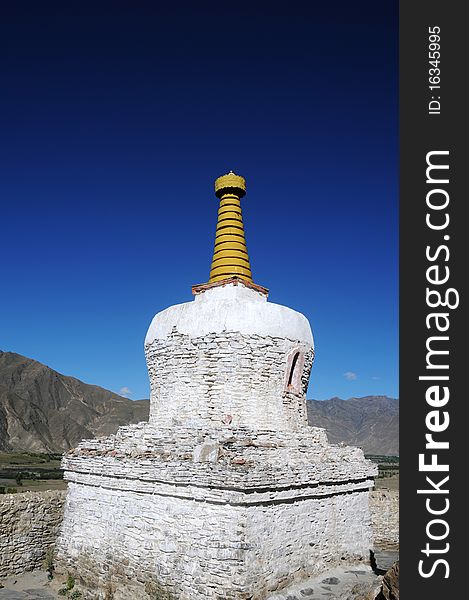 Scenery of a white buddhist stupa in Tibet,with blue skies as backgrounds. Scenery of a white buddhist stupa in Tibet,with blue skies as backgrounds.