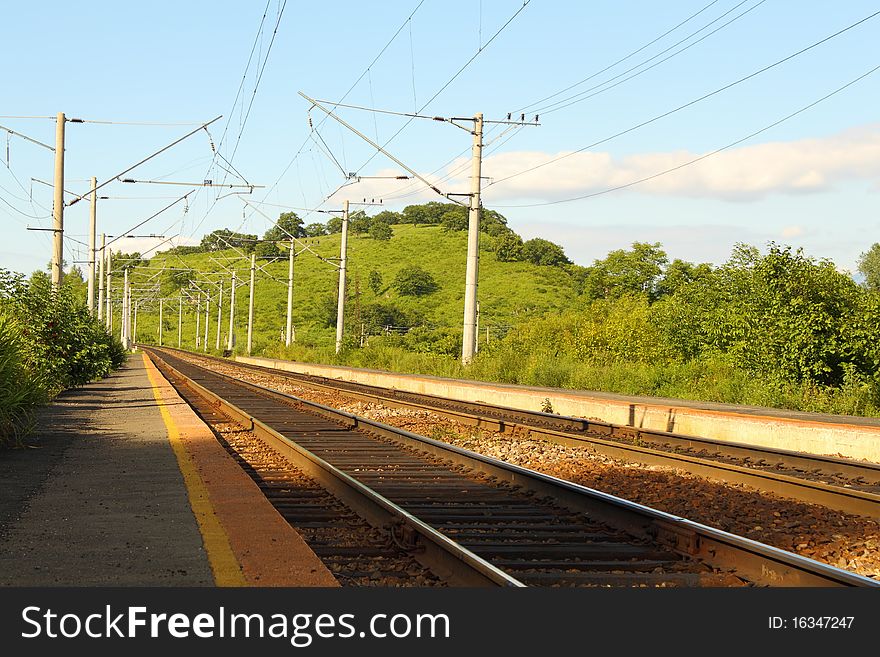 Two railway ways among hills and wood