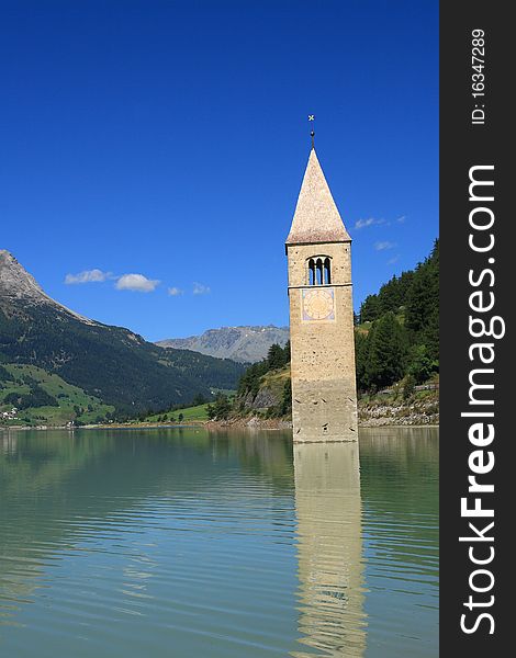 The bell tower is the last remains of Curon Vecchia, destroyed during the construction of the enormous artificial which was built to join the lakes of Curon and Resia, sacrificing a part of the town. The bell tower is the last remains of Curon Vecchia, destroyed during the construction of the enormous artificial which was built to join the lakes of Curon and Resia, sacrificing a part of the town.