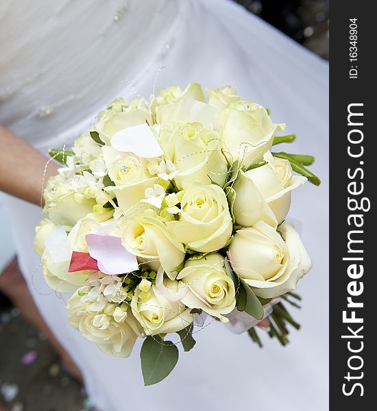 Bride's bouquet of cream roses with confetti