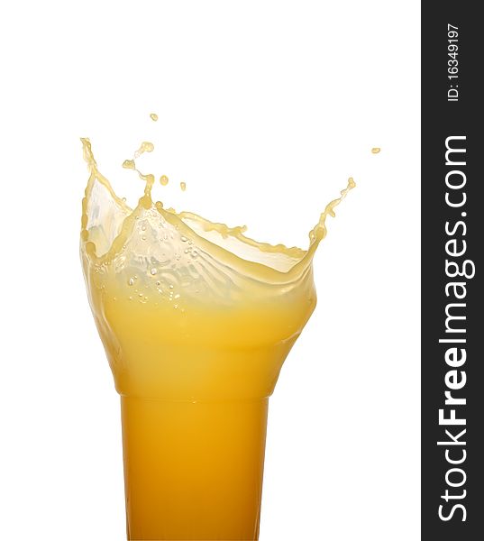 Glass of splashing orange juice isolated on white background with clipping path