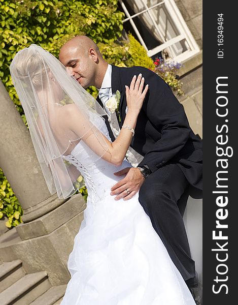 Intimate moment captured between a beautiful bride and groom