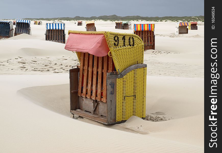 Beach chairs on the island of amrum on a lonely beach