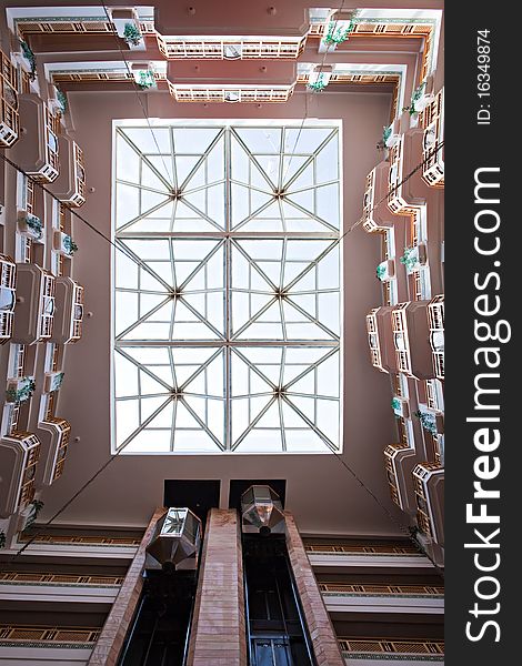 Bottom view on a glass ceiling of hotel