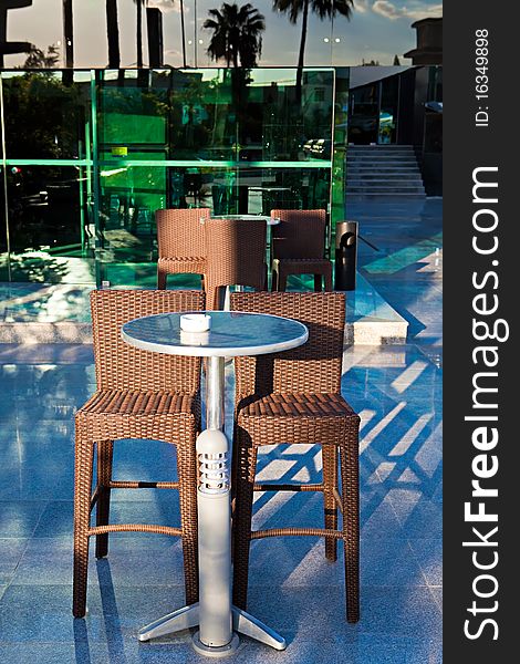 High wattled chairs and table in modern cafe. High wattled chairs and table in modern cafe