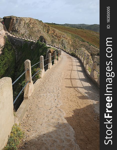 La Coupee causeway on Sark in the Channel Islands. La Coupee causeway on Sark in the Channel Islands