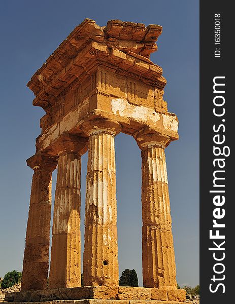 The image describes the remains of the famous temio the valley of the temples, located near the sicilian town of agrigento. The image describes the remains of the famous temio the valley of the temples, located near the sicilian town of agrigento.