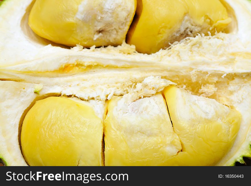 Durian cut open showing ripe fruit. For food and fruit concepts. Durian cut open showing ripe fruit. For food and fruit concepts.