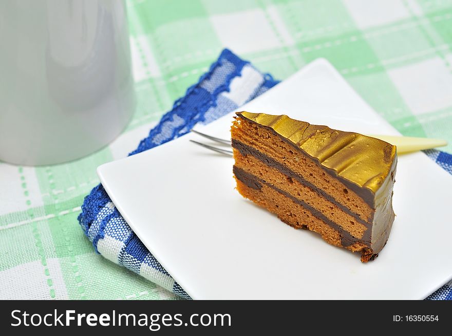 A slice of mouth watering golden chocolate cake. Suitable for celebrations, festivals, and food and beverage concepts. A slice of mouth watering golden chocolate cake. Suitable for celebrations, festivals, and food and beverage concepts.
