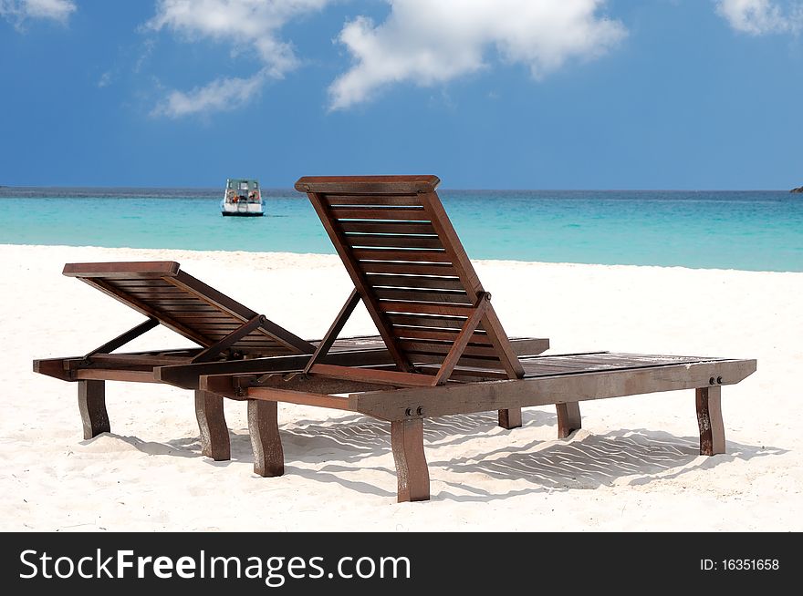 Two beach chairs on perfect tropical white sand