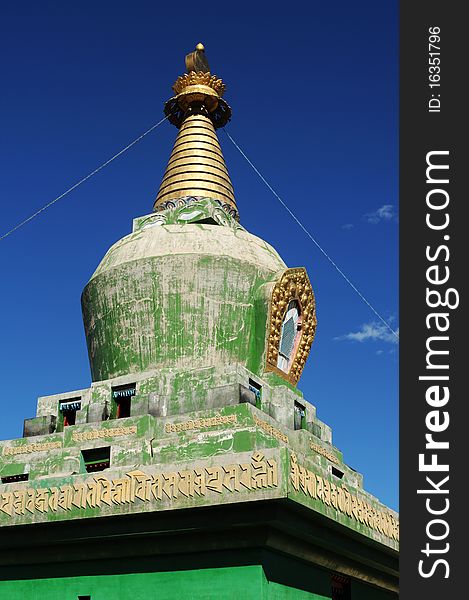 Scenery of a green buddhist stupa in Tibet,with blue skies as backgrounds. Scenery of a green buddhist stupa in Tibet,with blue skies as backgrounds.