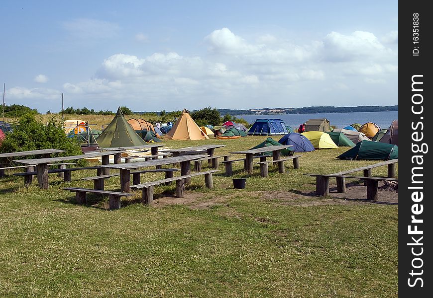 City of colorful tents in a sea beach camping site village. City of colorful tents in a sea beach camping site village