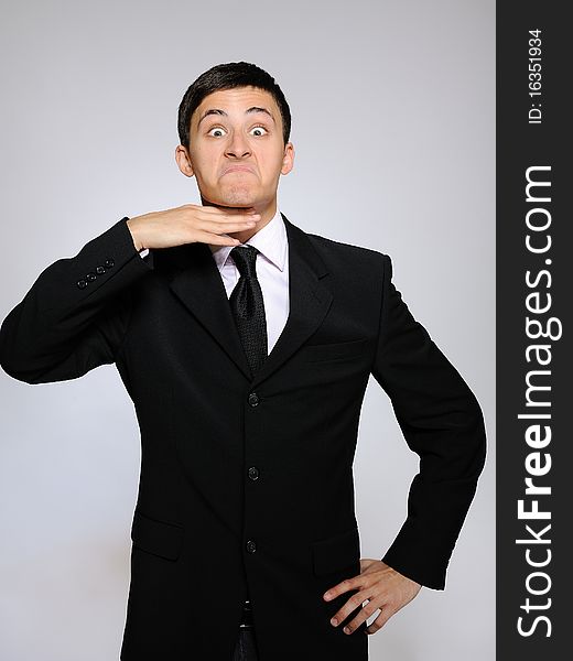 Expressions - young tired business man. gray background. Expressions - young tired business man. gray background