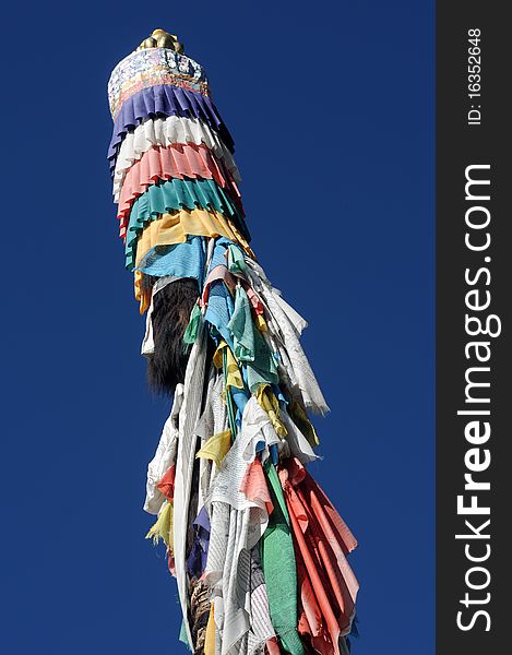 Scenery of colorful prayer flags in Tibet, with blue skies as backgrounds.