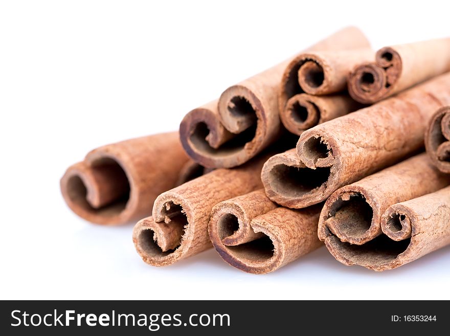 A pile of Cinnamon sticks isolated on white studio background.