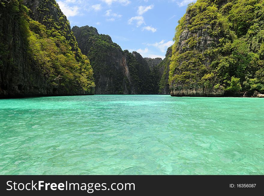 Green lagoon between rocks in thailand