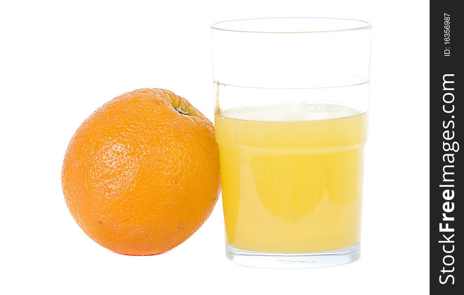 Navel orange with tumbler of juice white background with room for copy space. Navel orange with tumbler of juice white background with room for copy space