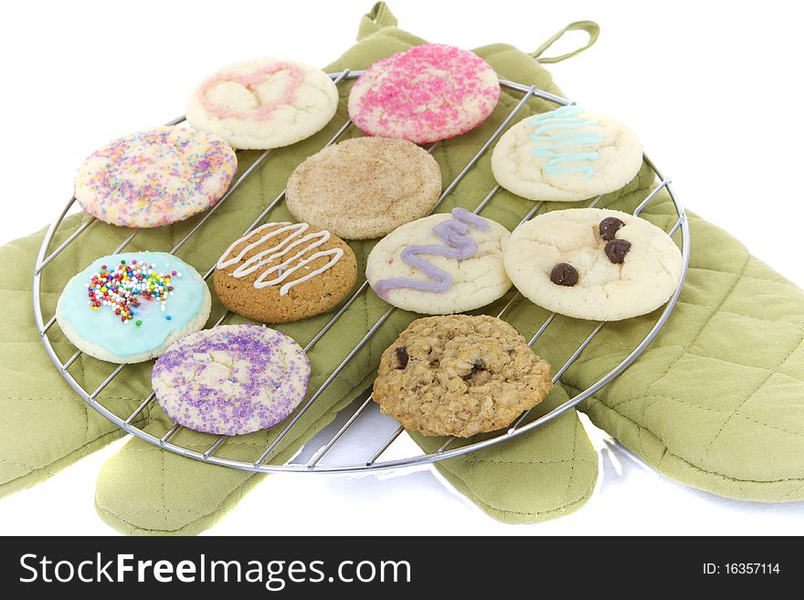 Organic homemade allergen free cookies on cooling rack with cooking mitts. Organic homemade allergen free cookies on cooling rack with cooking mitts