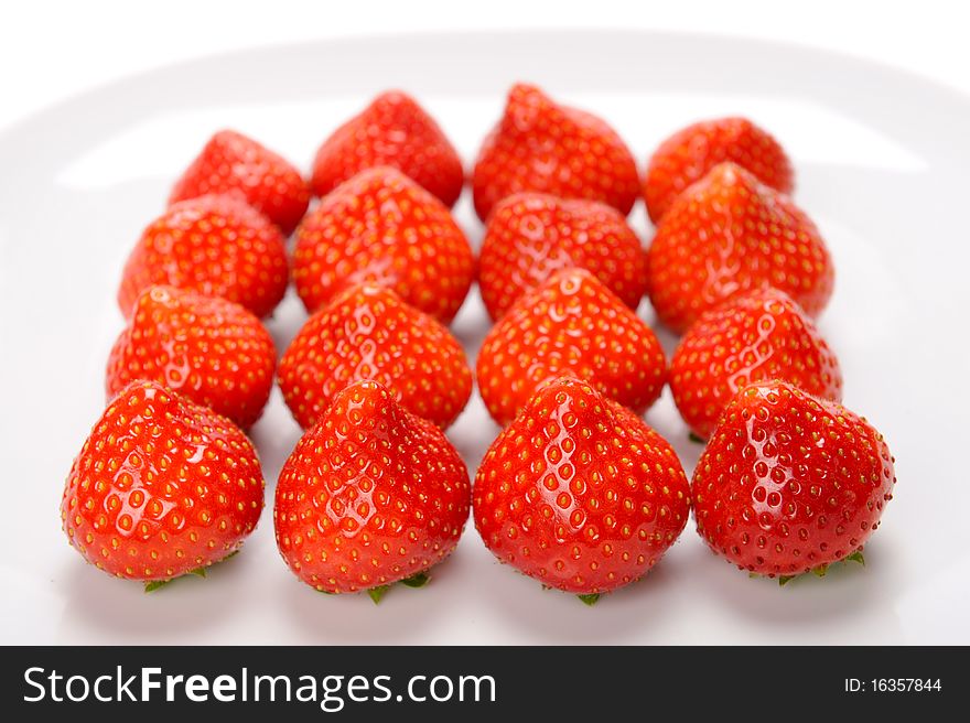 Strawberries lying on white plate. Strawberries lying on white plate