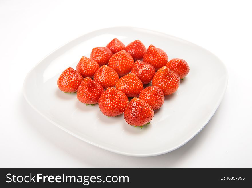 Strawberries lying on white plate. Strawberries lying on white plate
