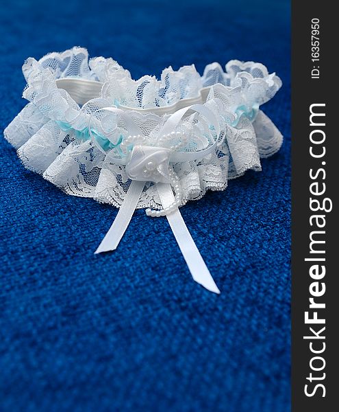 Wedding garter with a blue background