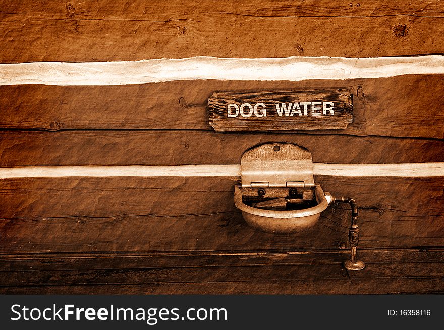 Detail of dog water sign and watering fountain. Detail of dog water sign and watering fountain