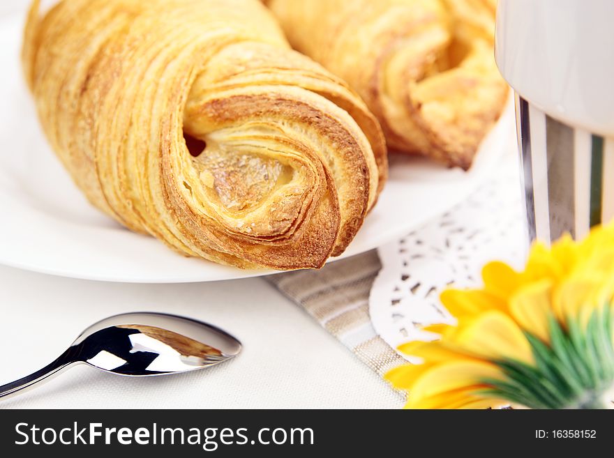 Fresh croissant closeup on breakfast table