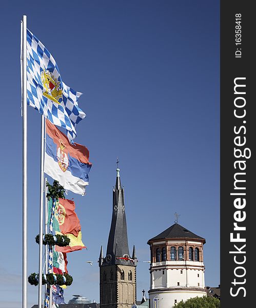 Flags and the Church of St. Lambertus in DÃ¼sseldorf, Germany