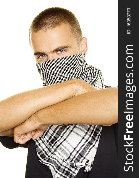 Young man dressed in black t-shirt on the face of a Palestinian scarf. Hands crossed on his chest. Stubble on his face. Isolated on a white. Young man dressed in black t-shirt on the face of a Palestinian scarf. Hands crossed on his chest. Stubble on his face. Isolated on a white