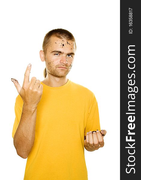 Handsome young man, his face and hands stained the soil. Finger of his right hand is raised. Isolated on a white background. Handsome young man, his face and hands stained the soil. Finger of his right hand is raised. Isolated on a white background